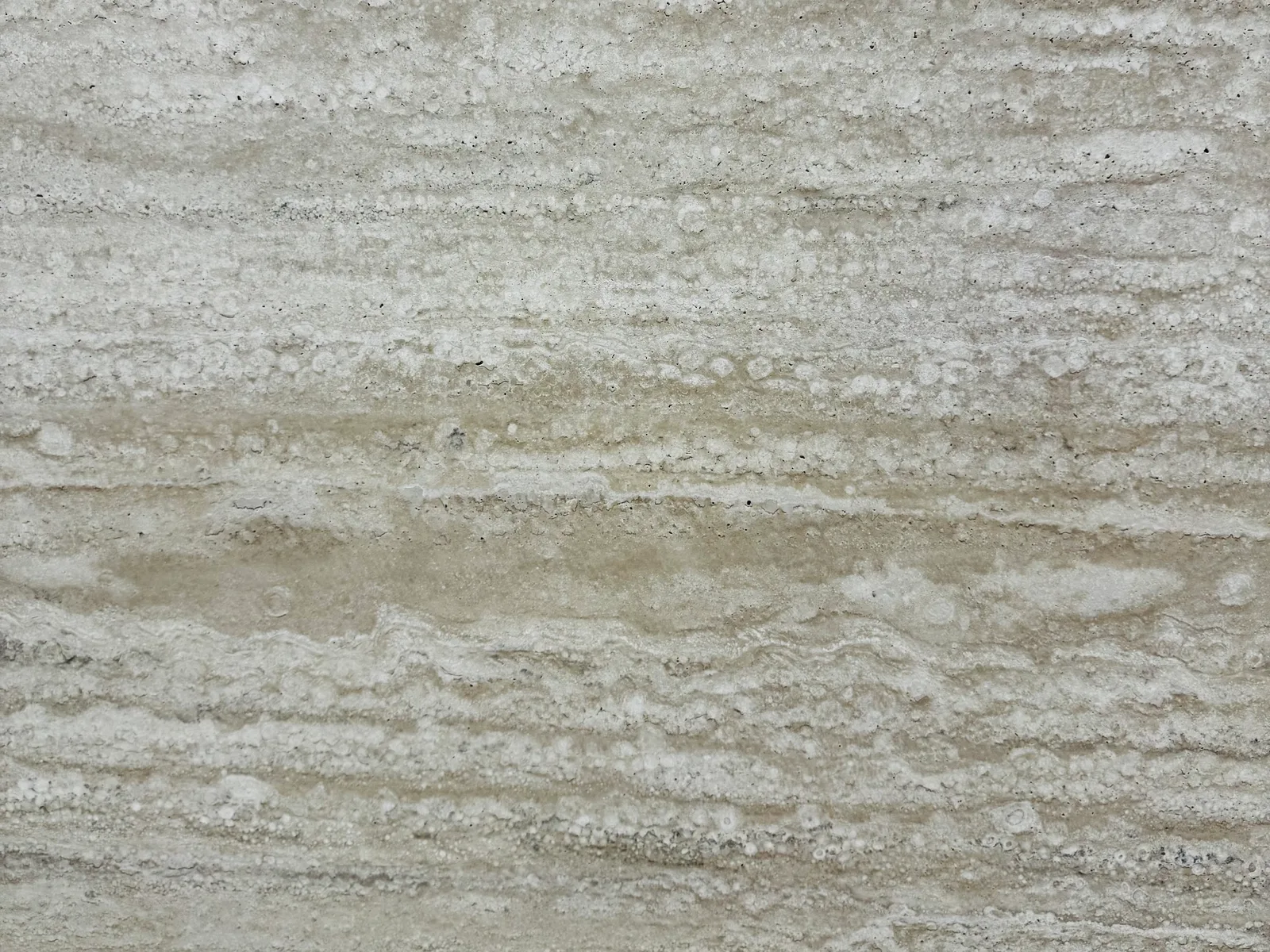 Close-up of a travertine slab surface